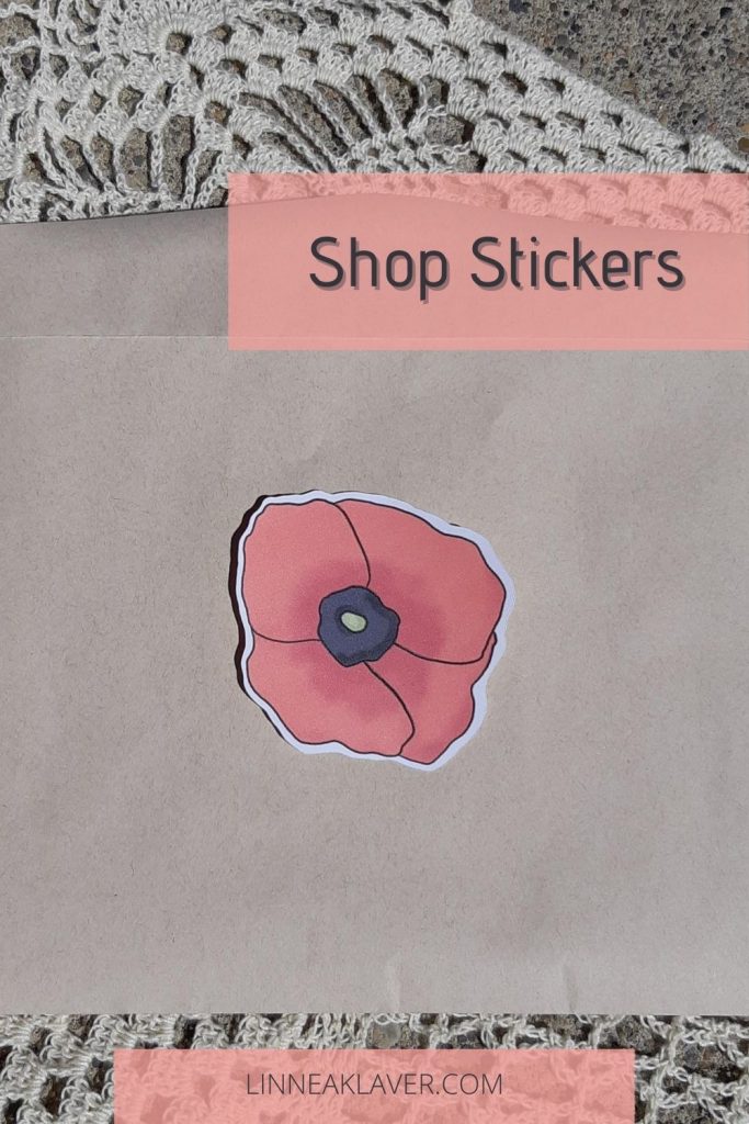 Image of a poppy sticker on an envelope that says "Shop Stickers"